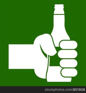 Hand holding bottle of beer icon white isolated on green background. Vector illustration. Hand holding bottle of beer icon green