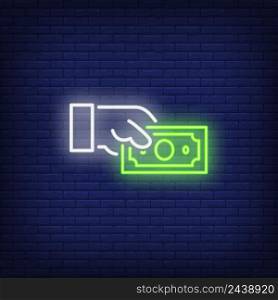 Hand holding dollar bill neon sign. Money, finance and payment concept. Advertisement design. Night bright neon sign, colorful billboard, light banner. Vector illustration in neon style.