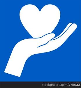 Hand holding heart icon white isolated on blue background vector illustration. Hand holding heart icon white