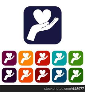 Hand holding heart icons set vector illustration in flat style In colors red, blue, green and other. Hand holding heart icons set flat