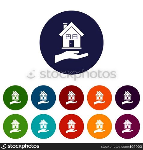 Hand holding house set icons in different colors isolated on white background. Hand holding house set icons