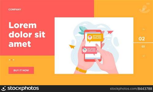 Hand holding mobile phone with online messages flat vector illustration. Modern smartphone screen with chat. Communication and conversation concept