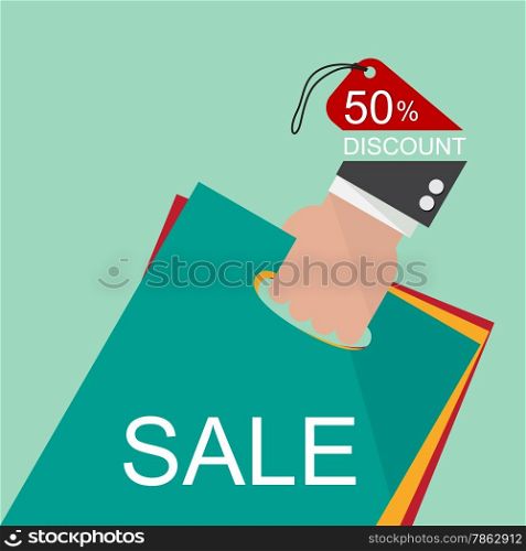 Hand holding shopping bags to promote sales.