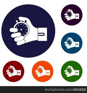 Hand holding stopwatch icons set in flat circle reb, blue and green color for web. Hand holding stopwatch icons set
