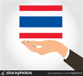 hand holding Thailand flag and background