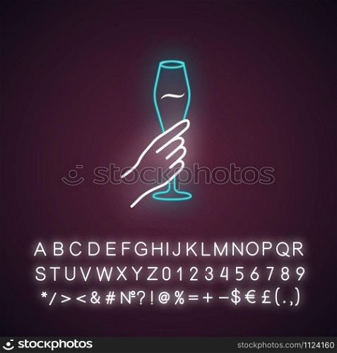 Hand holding tulip wine glass blue neon light icon. Champagne flute. Glassful of alcohol drink. Wine service. Celebration. Glowing sign with alphabet, numbers and symbols. Vector isolated illustration