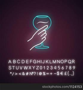 Hand holding wine glass blue neon light icon. Glassful of alcohol beverage. Wine service. Stemware. Toast. Cheers. Glowing sign with alphabet, numbers and symbols. Vector isolated illustration