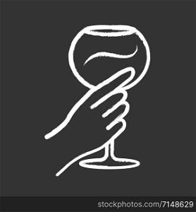 Hand holding wineglass chalk icon. Glassful of alcohol beverage. Wine service. Glassware. Celebration, party. Wedding. Tasting, degustation. Cheers. Isolated vector chalkboard illustration