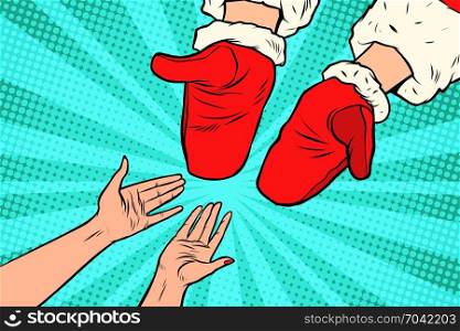 Hand of Santa Claus and women. New year and Christmas. Pop art retro vector illustration. Hand of Santa Claus and women