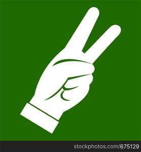Hand showing victory sign icon white isolated on green background. Vector illustration. Hand showing victory sign icon green