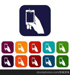 Hand taking pictures on cell phone icons set vector illustration in flat style in colors red, blue, green, and other. Hand taking pictures on cell phone icons set
