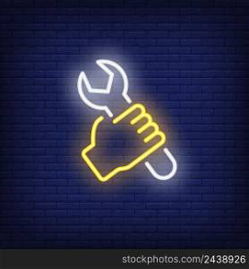 Hand with wrench neon sign. Luminous signboard with worker with spanner. Night bright advertisement. Vector illustration in neon style for mechanic, service, handyman