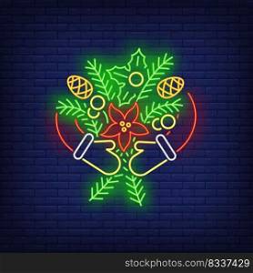 Hands in mittens embracing fir-tree twigs with cones neon sign. Winter season, Christmas, frost design. Night bright neon sign, colorful billboard, light banner. Vector illustration in neon style.