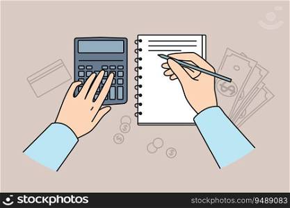 Hands of accountant using calculator for auditing and making entries in financial journal, located at table with money. Accounting services for preparation of financial analysis for business clients. Hands of accountant using calculator for auditing and making entries in financial journal