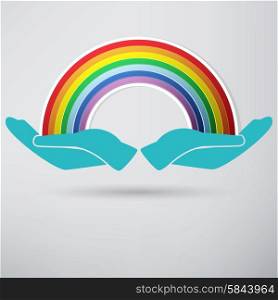 hands on background of the colorful rainbow