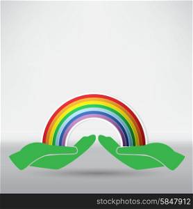 hands on background of the colorful rainbow