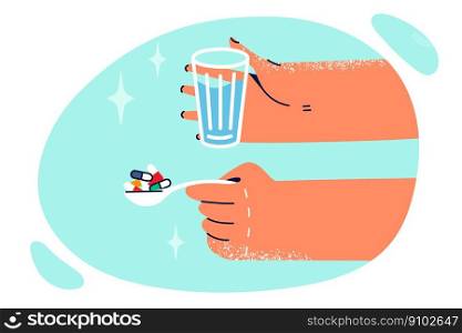 Hands with spoon filled with pills and glass of water for clinic patient during treatment of viral disease or flu. Pills with antibiotics and vitamins to treat diseases and maintain patient immunity . Hands with spoon filled with pills and glass of water for clinic patient during treatment of flu