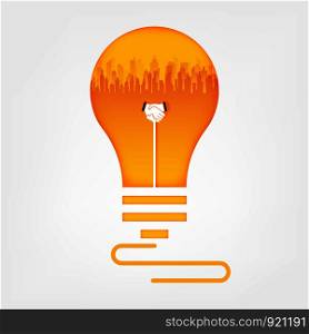 Handshake and city in light bulb. Business handshake cooperate concept.vector art and illustration.