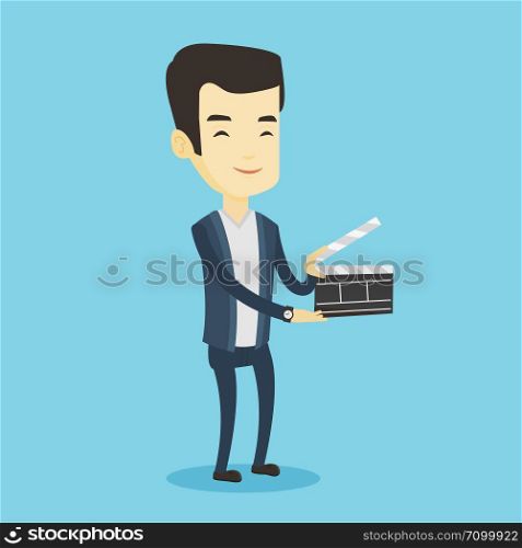 Happy asian man working with a clapperboard. Smiling man holding an open clapperboard. Cheerful man holding blank movie clapperboard. Vector flat design illustration. Square layout.. Smiling man holding an open clapperboard.