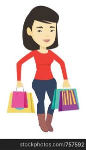 Happy asian woman carrying shopping bags. Young smiling woman holding shopping bags. Woman standing with a lot of shopping bags. Vector flat design illustration isolated on white background.. Happy woman with shopping bags vector illustration