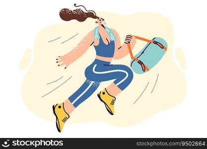 Happy athletic woman in sportswear holding bag with workout accessories and running to fitness club. Girl with towel around neck is returning from gymnastics or aerobics classes in fitness studio. Happy athletic woman in sportswear holding bag with workout accessories and running to fitness club