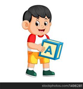happy boy holding the alphabet cube