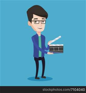 Happy caucasian man holding camera slate for the filming. Smiling man holding an open clapperboard. Cheerful man holding blank movie clapperboard. Vector flat design illustration. Square layout.. Smiling man holding an open clapperboard.