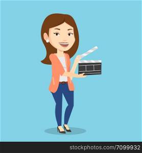 Happy caucasian woman working with a clapperboard. Smiling woman holding an open clapperboard. Cheerful woman holding blank movie clapperboard. Vector flat design illustration. Square layout.. Smiling woman holding an open clapperboard.