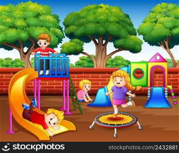 Happy children playing in the playground at daytime