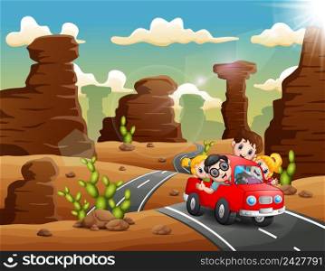 Happy children traveling by red car through the desert 