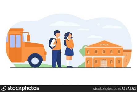 Happy children waiting school bus isolated flat vector illustration. Cartoon girl and boy standing on road near school building. Education and learning concept