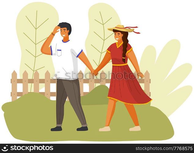 Happy couple in love is walking in sunny day. Smilling guy is walking with girl in hat outdoors. Free time activity in garden. People in relationship walk by handle in windy weather in city park. People in relationship walk by handle in windy weather. Smilling guy with girl in hat outdoors