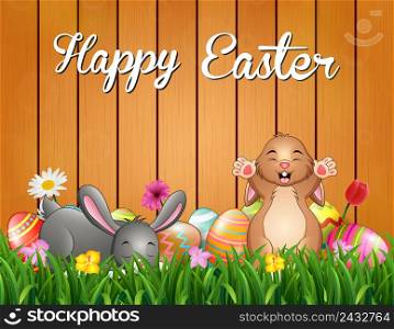 Happy easter bunnies on a background fence
