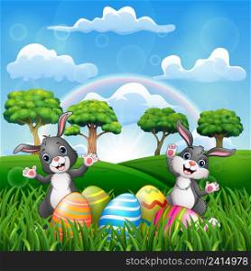 Happy easter with two bunnies on the nature 