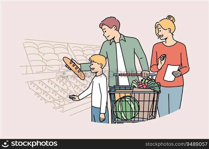 Happy family is shopping in supermarket, standing with trolley near shelves with fresh bread. Boy visits grocery store with parents choosing pastries or bread, for concept of healthy diet. Happy family is shopping in supermarket, standing with trolley near shelves with fresh bread