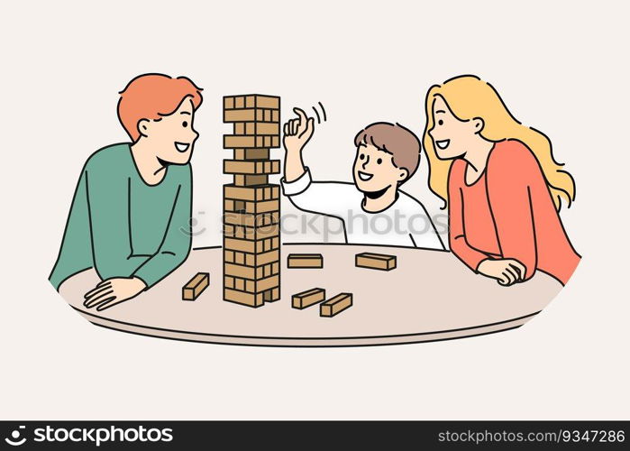 Happy family plays jenga with child enjoying board game and developing fine motor skills in baby. Satisfied boy plays jenga with parents pulling wooden block out of unstable tower.. Happy family plays jenga with child enjoying board game and developing fine motor skills in baby