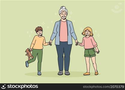 Happy grandmother active lifestyle concept. Smiling positive grandmother standing holding her grandchildren girl and boy with hands feeling cheerful vector illustration . Happy grandmother active lifestyle concept