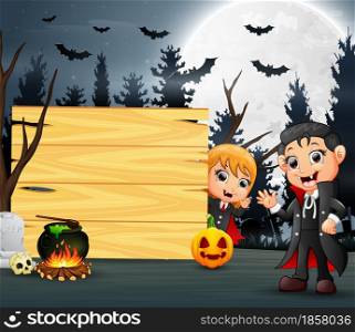 Happy halloween with two vampire and wooden board