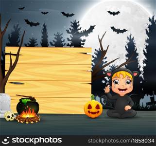 Happy kid wearing cat costume sitting beside the wooden board