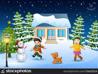 Happy kids playing in front of the snowing house on the christmas day
