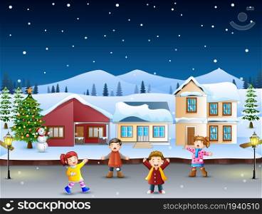 Happy kids playing in front of the snowing village on the christmas day