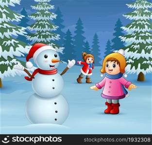 Happy kids playing with a snowman in winter