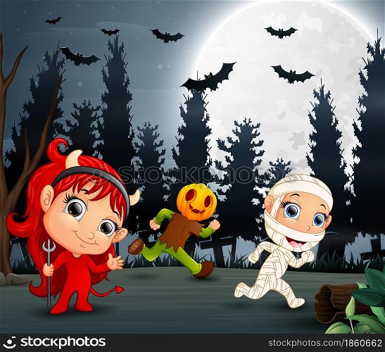 Happy kids wearing halloween costume in the garden