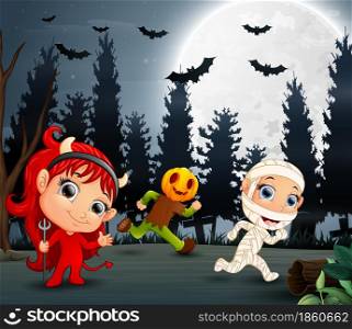 Happy kids wearing halloween costume in the garden