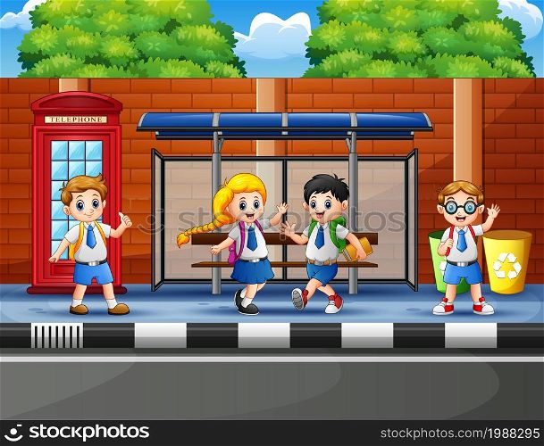 Happy school children at the bus stop