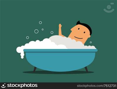Happy smiling businessman relaxing in a bathtub with foam. Businessman relaxing in bathtub with foam
