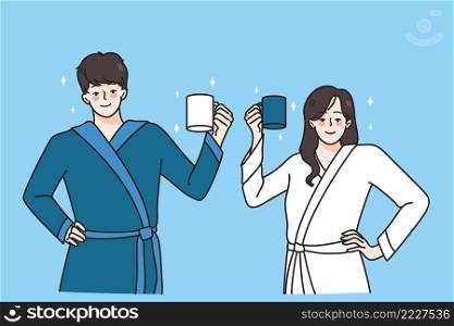Happy young couple in bathrobes hold mugs drinking coffee in morning welcome new day. Smiling man and woman with cups have breakfast at home together. Habit concept. Vector illustration. . Happy couple in bathrobes with mugs in morning 