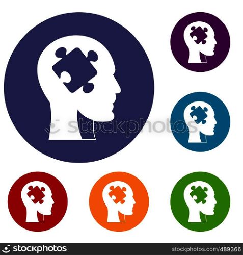 Head with puzzle icons set in flat circle red, blue and green color for web. Head with puzzle icons set