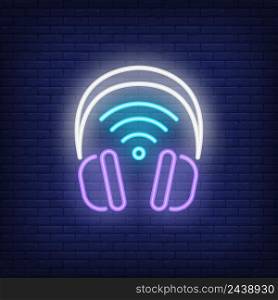 Headphones with wi-fi symbol neon sign. Wifi, communication, technology concept. Advertisement design. Night bright neon sign, colorful billboard, light banner. Vector illustration in neon style.
