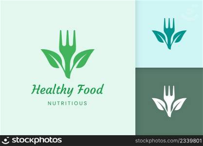 healthy food logo with fork and leaf shape